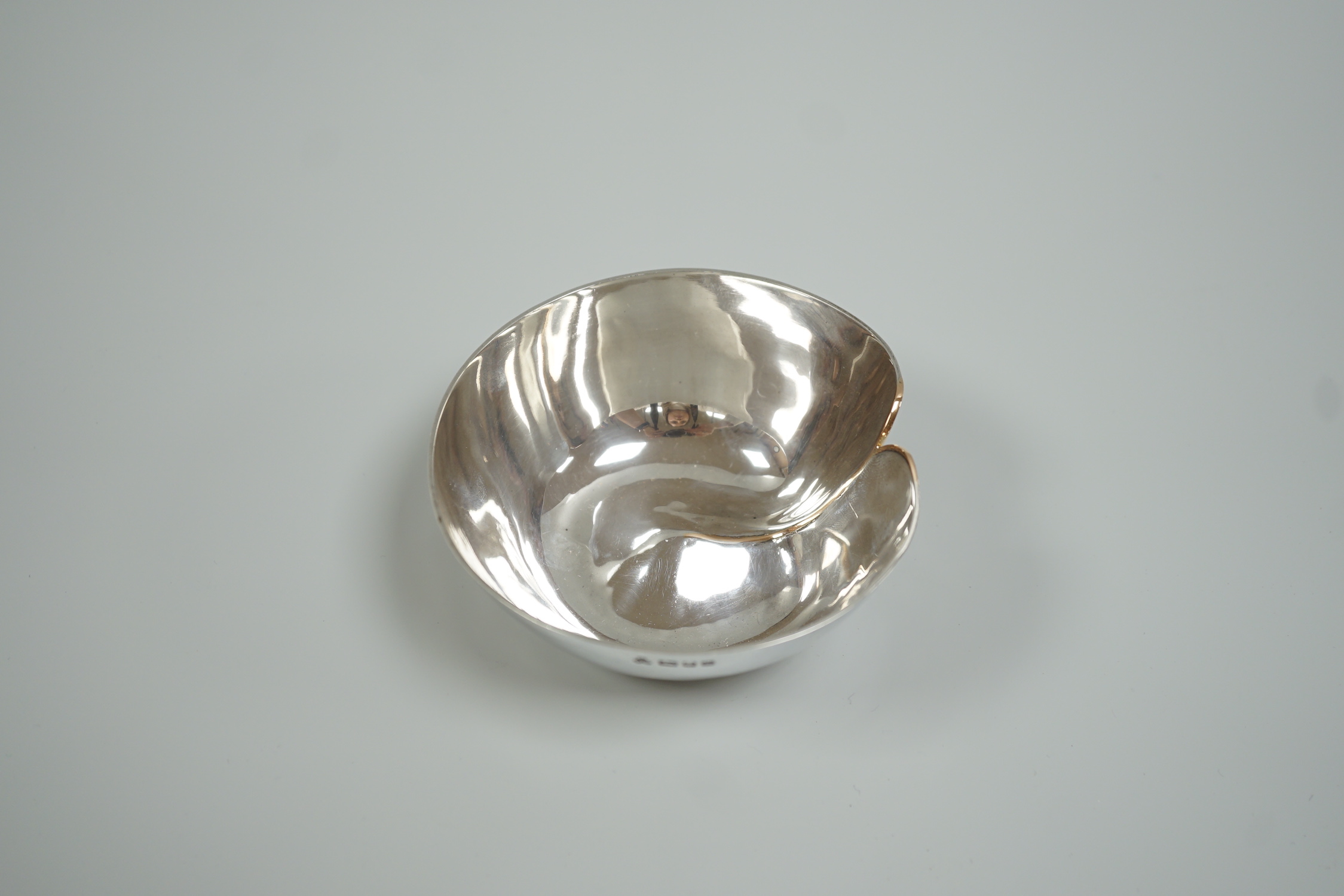 A modern silver dimpled bowl, maker CJW, London, 1982, width 10cm, 116 grams.